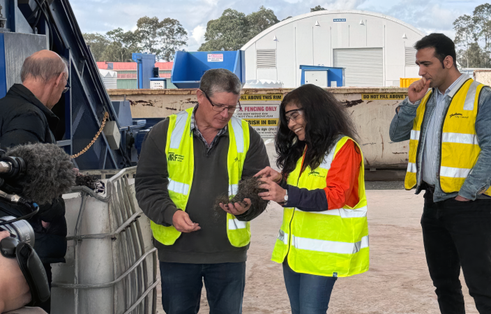 Inspecting crumb rubber produced at Shoalhaven Recycling Centre