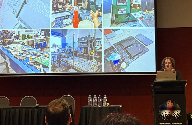 Jen McHugh from James Cook University shows images of recycling technology